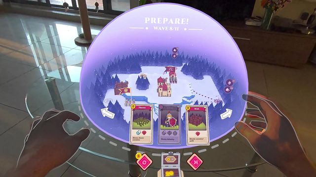 Choosing cards for the next wave inside the mixed reality dome, using hand tracking